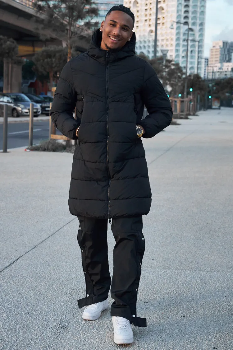 Doudoune matelassée longue noire à capuche