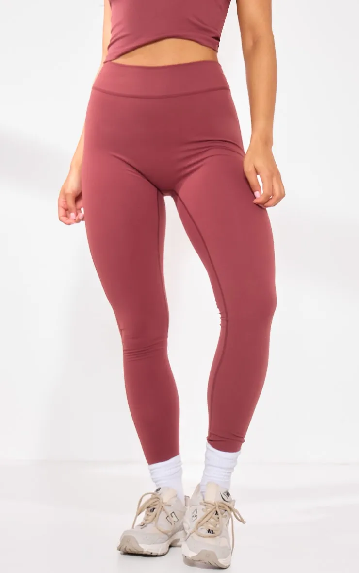 Legging en sculpt rouge à détail contours