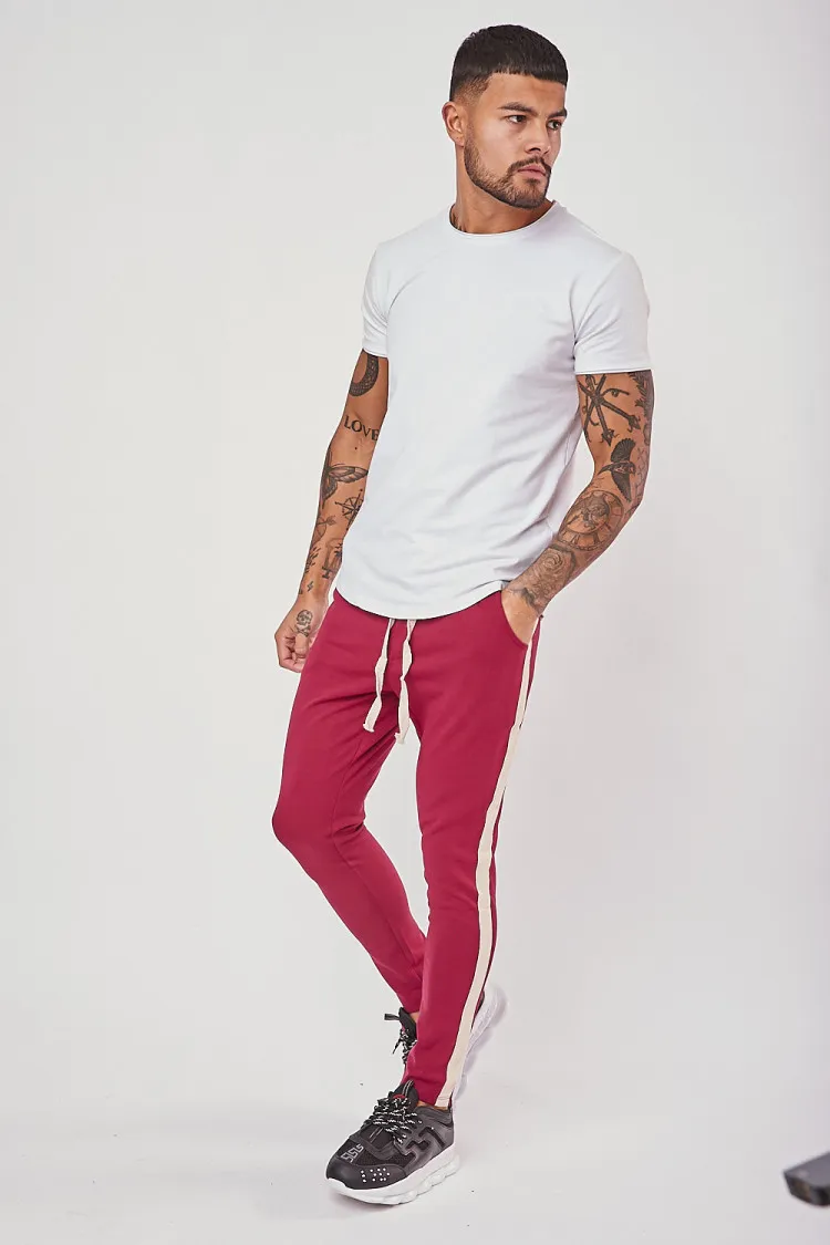 Pantalon slim bordeaux à bandes