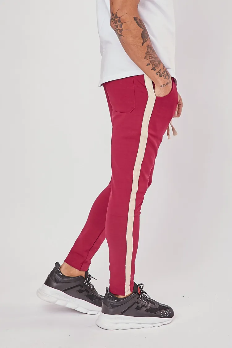 Pantalon slim bordeaux à bandes