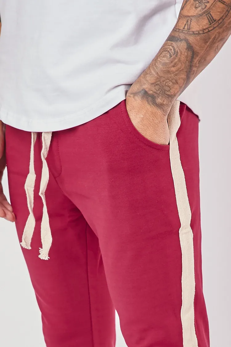 Pantalon slim bordeaux à bandes